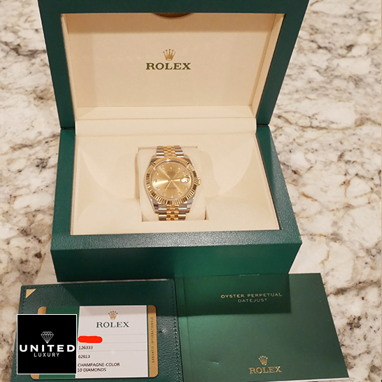 Rolex 126333 Yellow Gold Diamond Jubilee Replica in the box next to warranty card