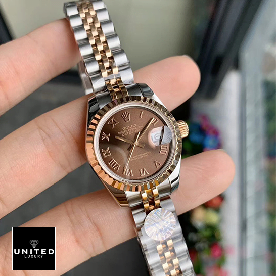 Rolex Datejust 288271 Everose Gold Roman Dial Replica on the fingers